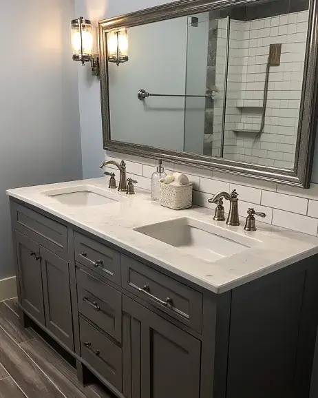 Gray double sink bathroom vanity with a minimalist design and subway tile backsplash.